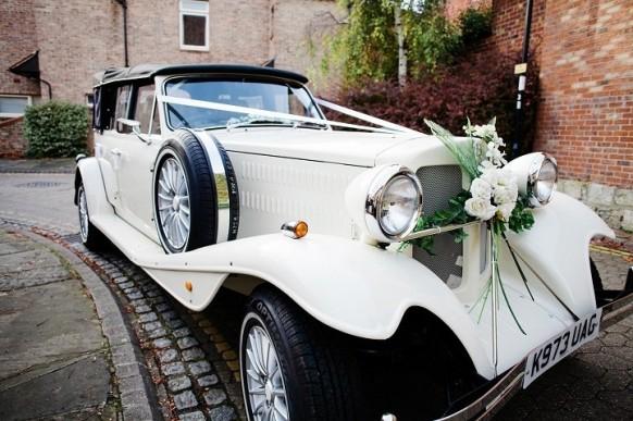 wedding photo - Classy white vintage decorated car