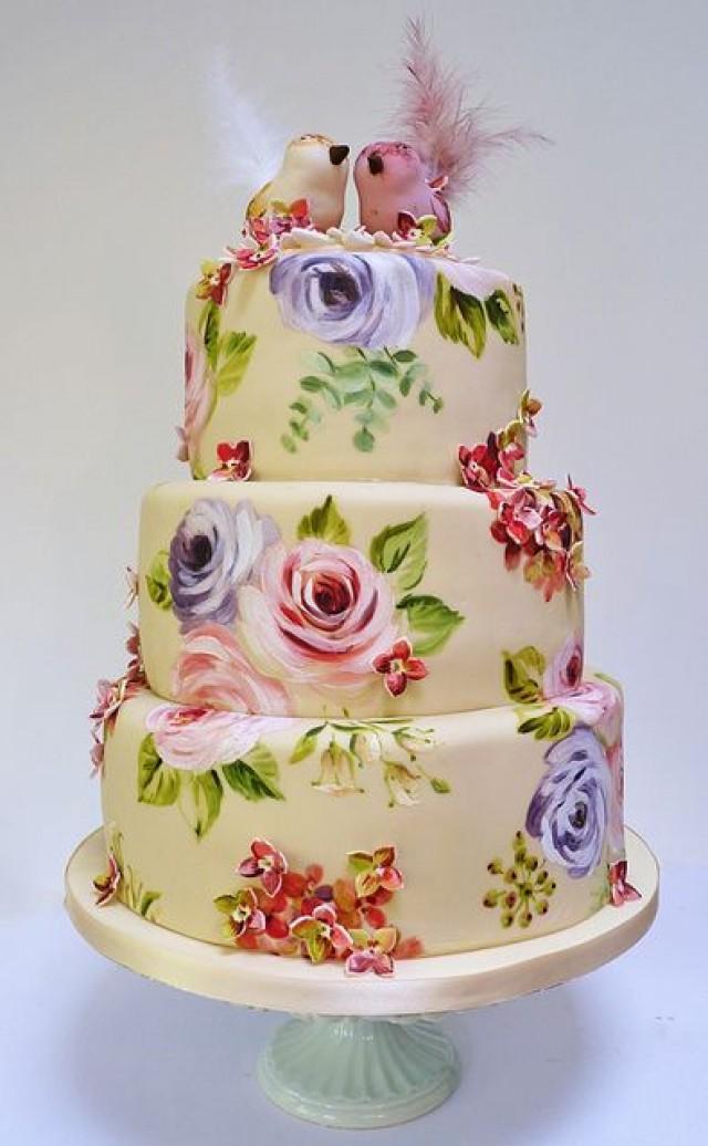 wedding photo - Floral cake decorated with two birds on the top.