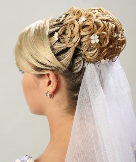 Wedding - Stylishly made wedding bun with decorative flowers adorned