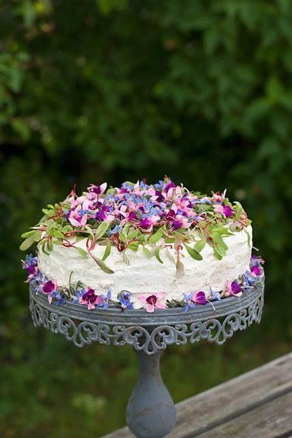Wedding - White wedding cake decorated with pink and purple petals