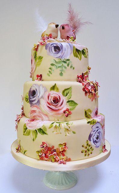Wedding - Floral cake decorated with two birds on the top.