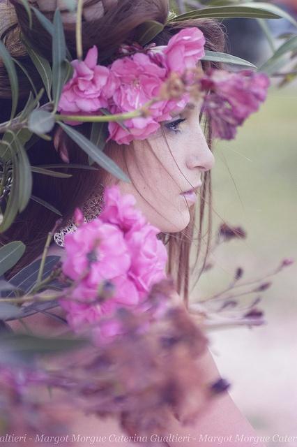 Wedding - Woman in the middle of pink-colored flowers.