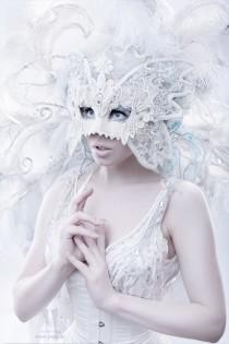 wedding photo - Wedding white-colored masquerade mask to hide your face.
